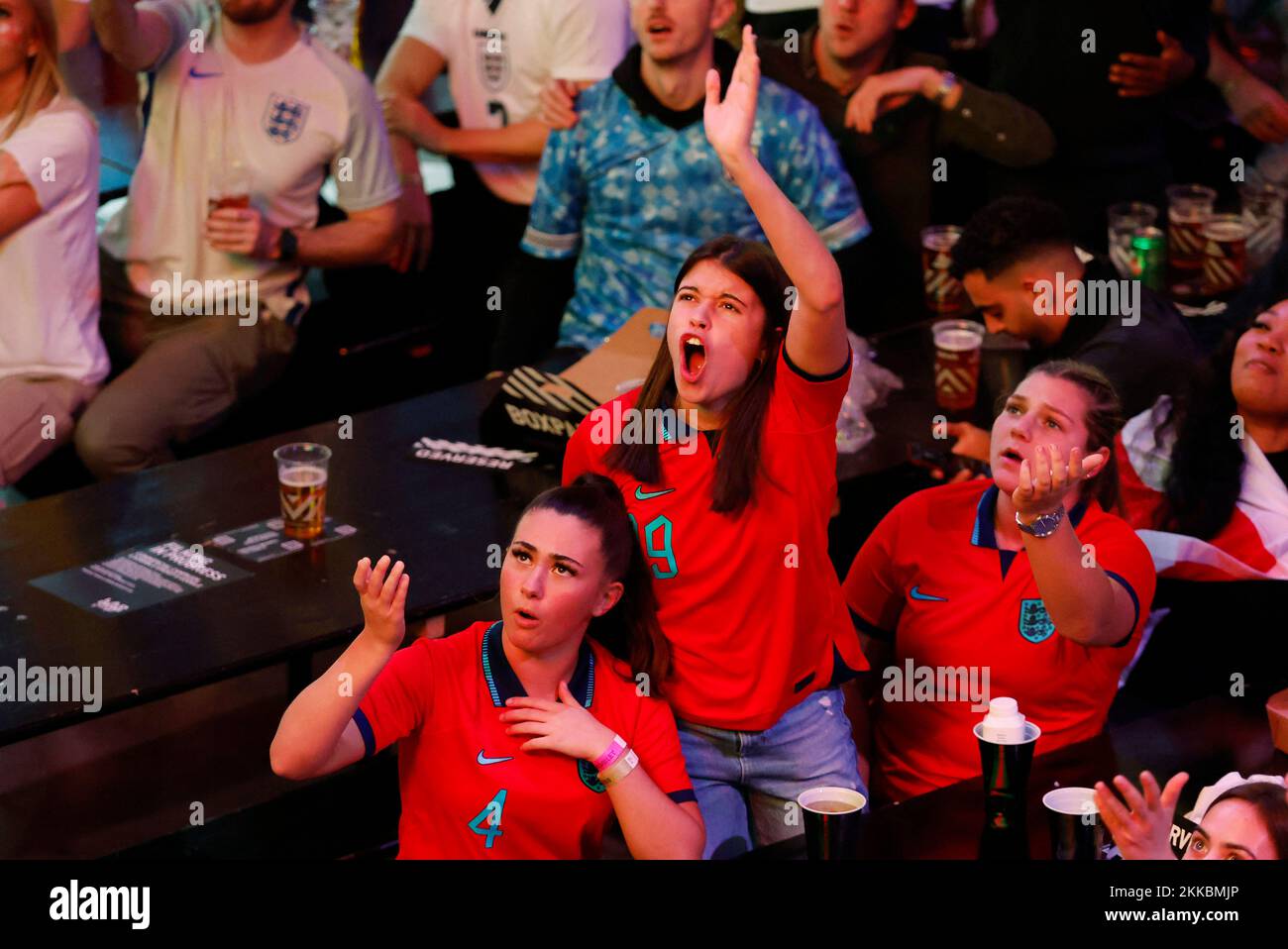 Soccer Football - FIFA World Cup Qatar 2022 - Fans in London watch England v United States - Wembley Boxpark, London, Britain - November 25, 2022  England fans react as they watch the match Action Images via Reuters/Andrew Couldridge Stock Photo