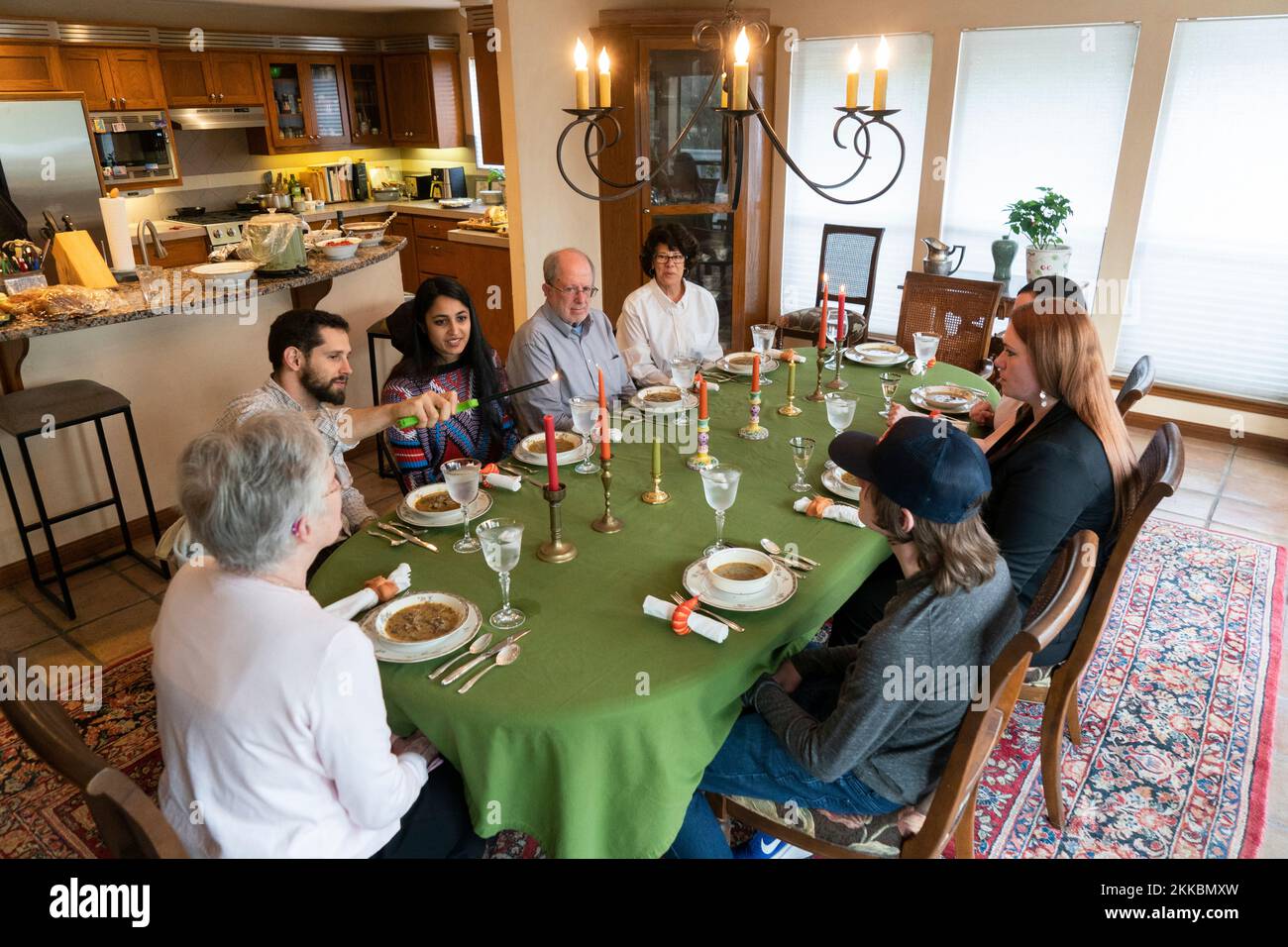 Austin Texas USA, November 204 2022: Extended family sits down to Thanksgiving dinner. ©Bob Daemmrich Stock Photo