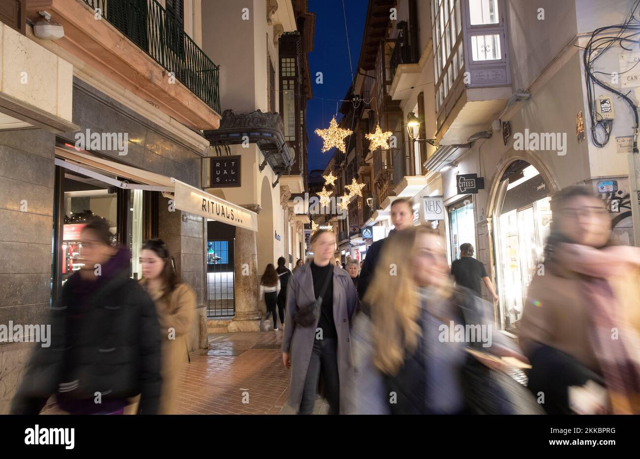 Palma, Spain. 25th Nov, 2022. People walk through a shopping street in  downtown Palma on Mallora on Black Friday. A flood of special offers a few  weeks before Christmas, Black Friday has