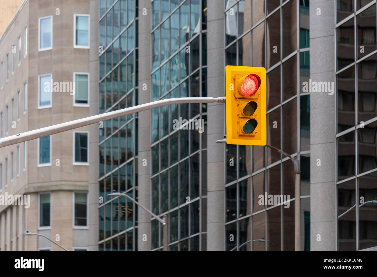 Traffic light against office buildings in downtown Ottawa, Canada Stock