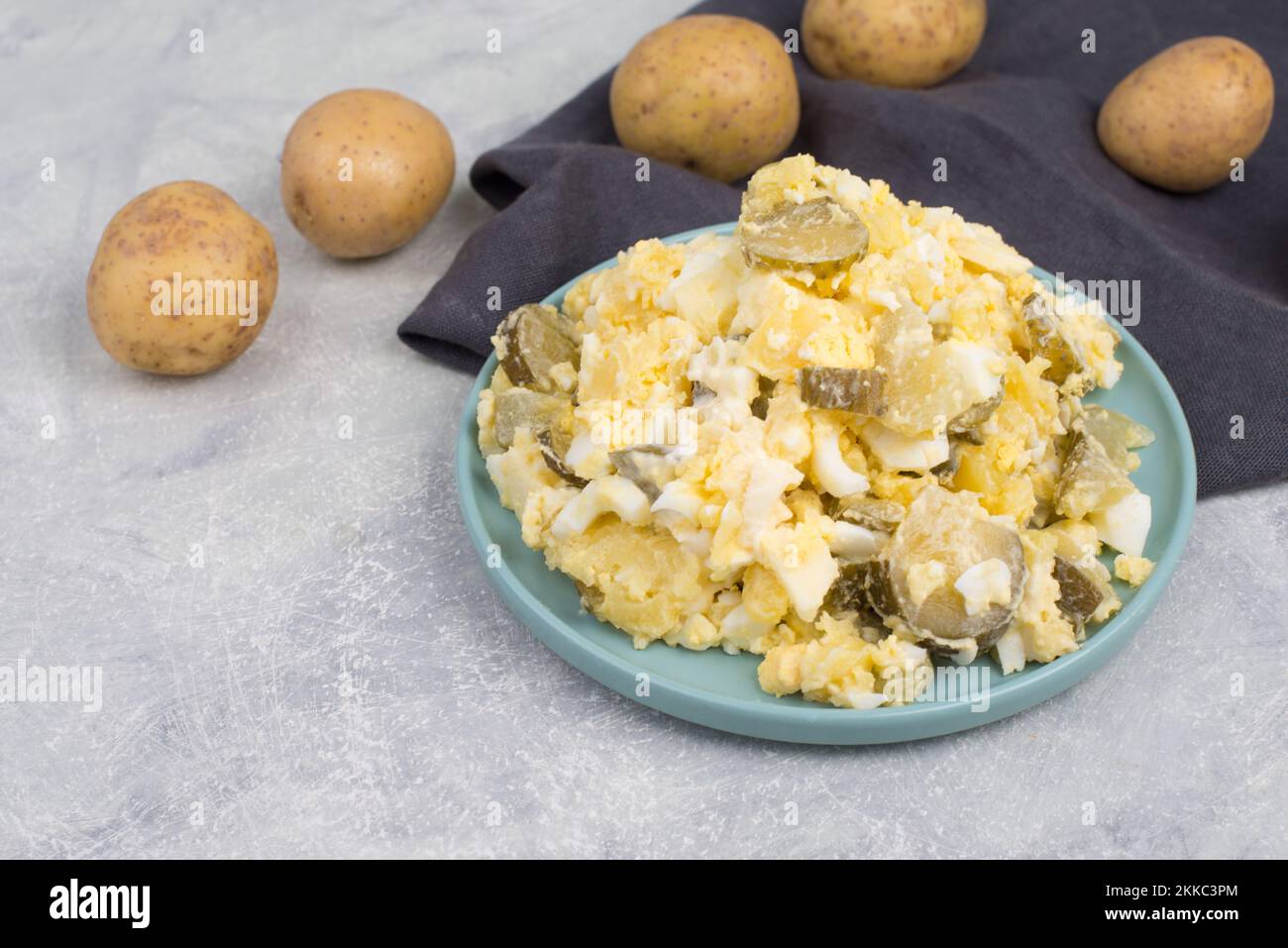 Potato salad on a plate, traditional german party food with eggs