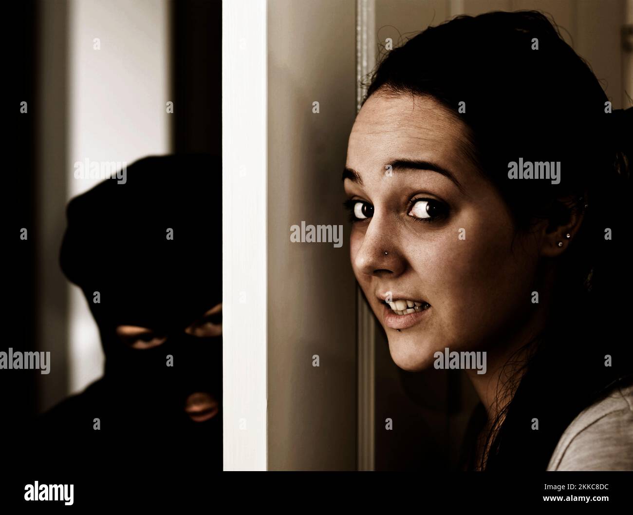 The Scene Of A Home Invasion Where A Masked Man Creeps In The Front