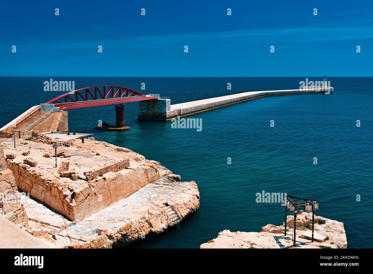 An aerial shot of the single-span arched bridge of St Elmo on the blue sea in Valletta, Malta Stock Photo