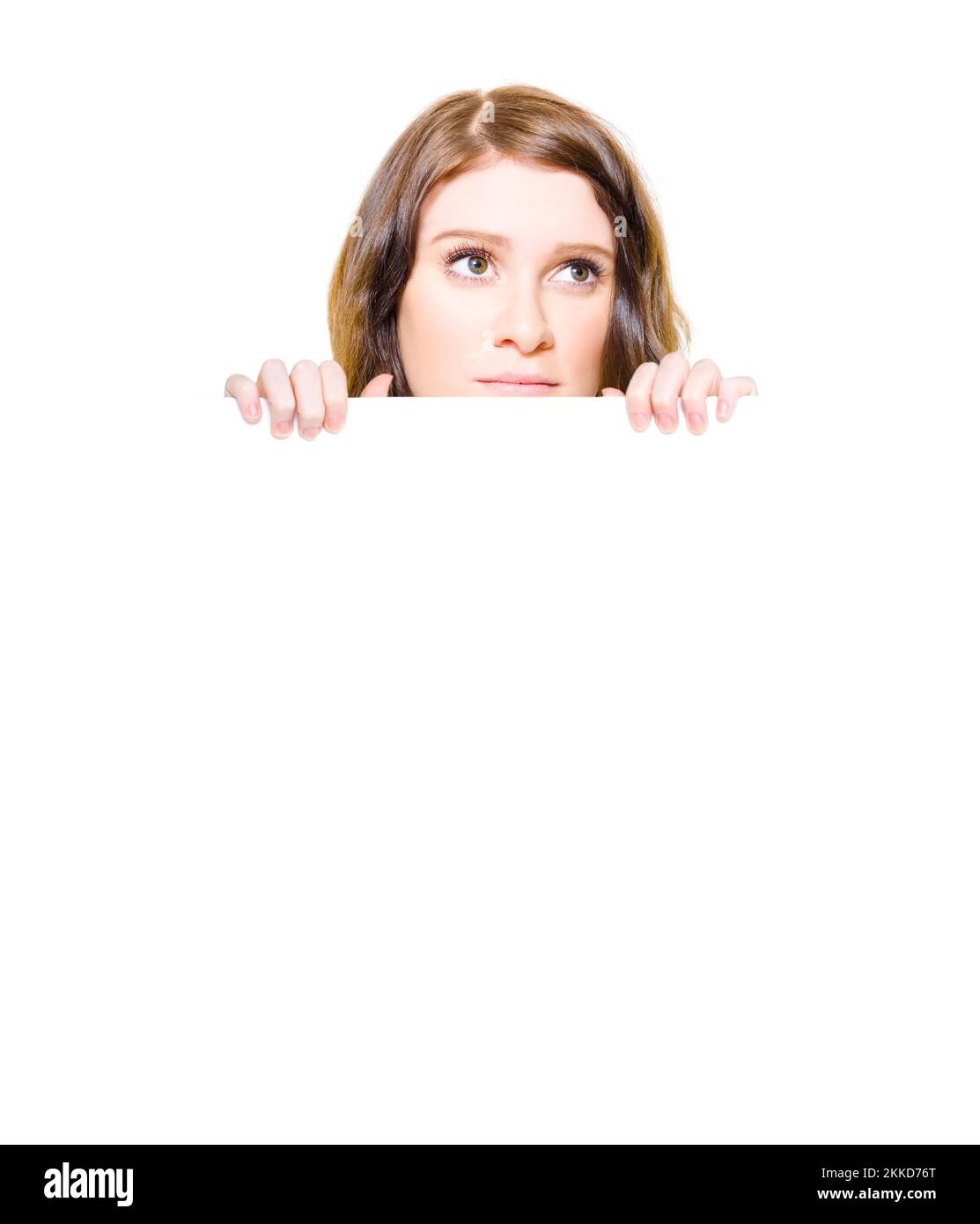 Isolated Image Of A Sad And Unhappy Woman With A Look Of Wanting, Yearning And Longing Holding A Large White Blank Sign Board In A Wish List Concept Stock Photo
