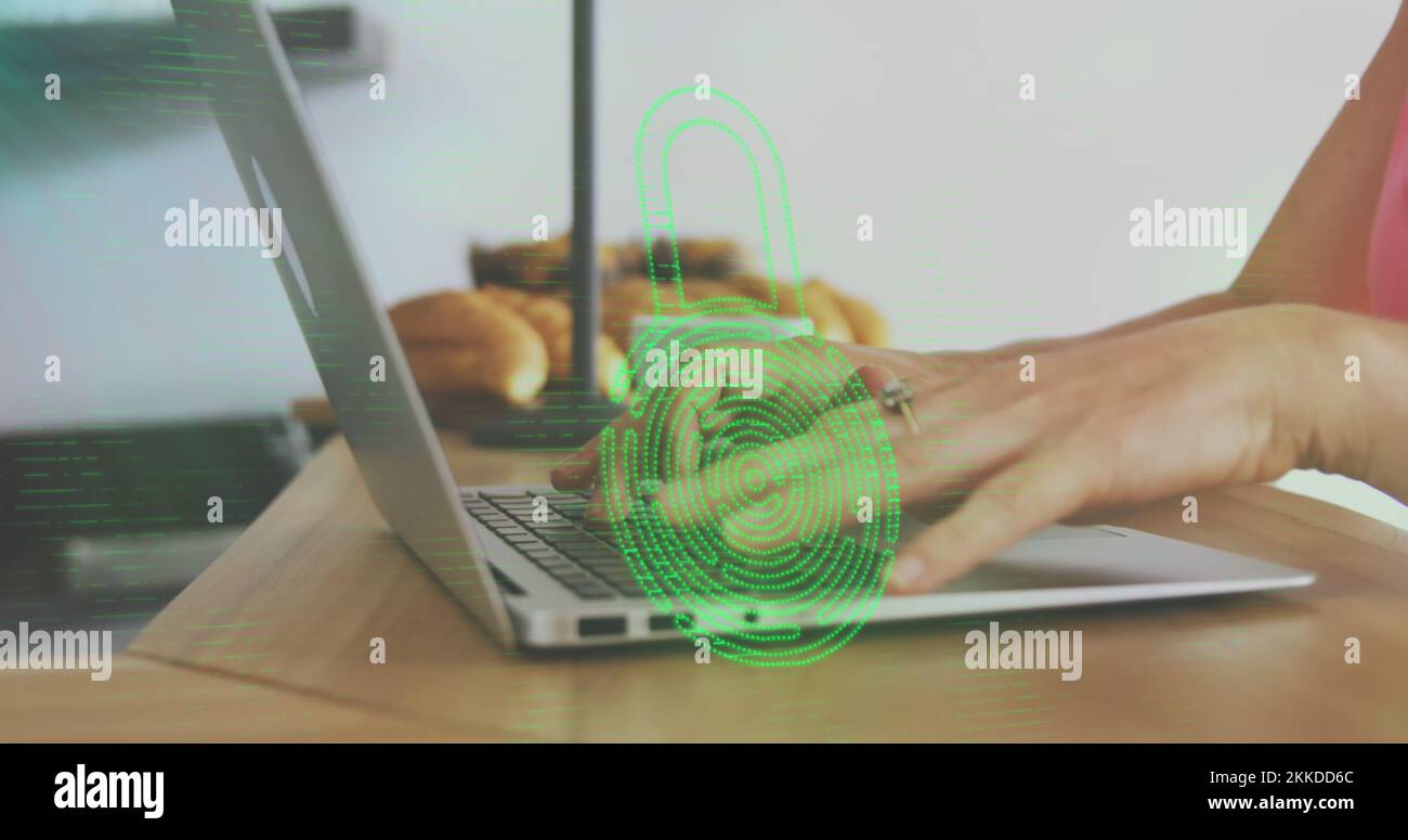Image of biometric fingerprint padlock, data processing over woman using laptop Stock Photo