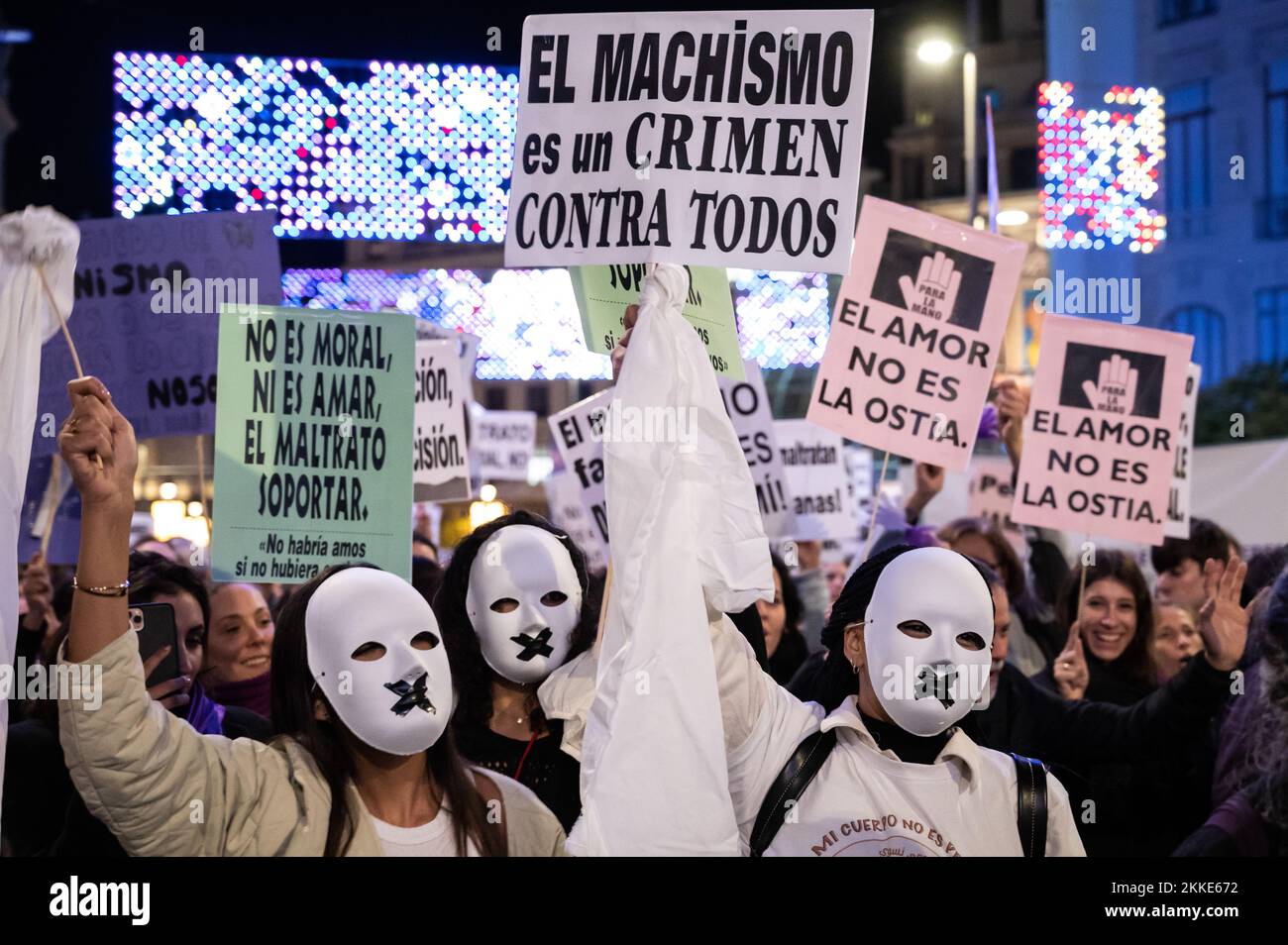 Madrid, Spain. 25th Nov, 2022. Women wearing masks and carrying placards against machismo protesting during a demonstration for the International Day for the Elimination of Violence Against Women. Credit: Marcos del Mazo/Alamy Live News Stock Photo