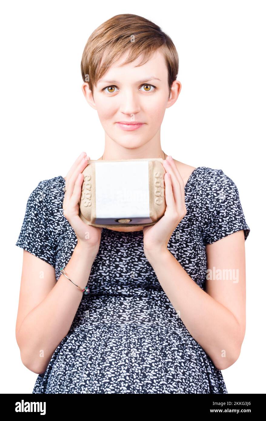 Pretty young pregnant woman holding carton of fresh eggs with a blank