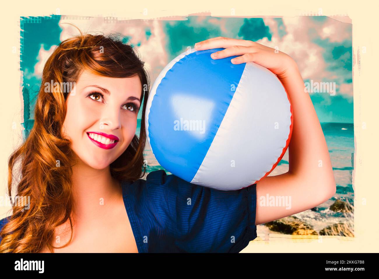 Smiling retro woman at the beach holding a beach ball in a ninteen