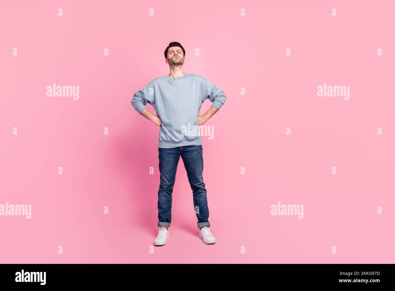 Full size photo of overconfident guy hands waist feeling egocentric isolated on pastel color background Stock Photo
