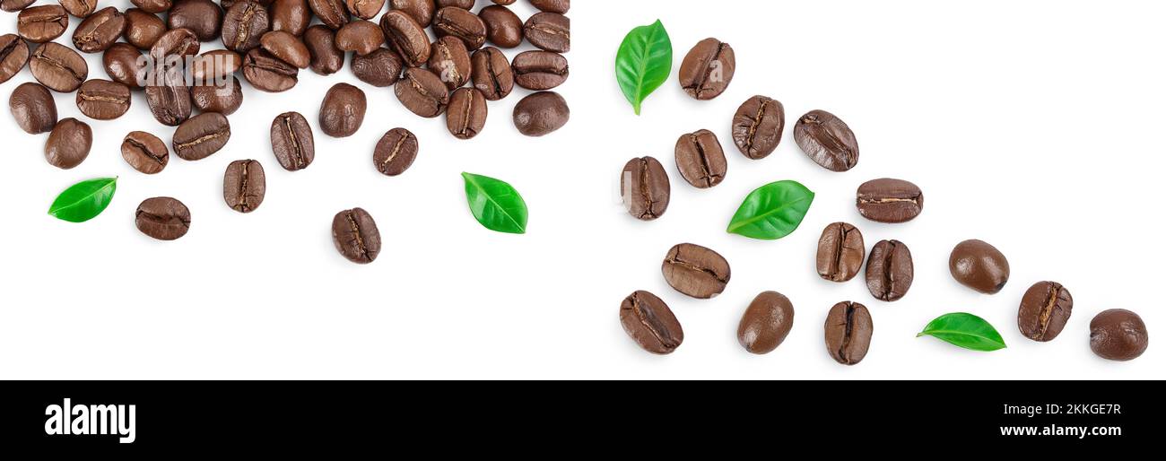 Heap of roasted coffee beans with leaves isolated on white background ...