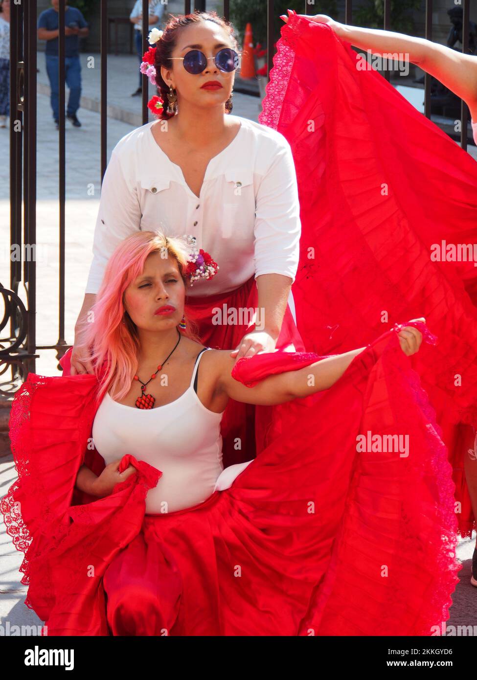 Women from 'Red Tide' activist group performing in red skirts in the street of Lima as part of the activities of the International Day for the Elimination of Violence against Women, an event that is commemorated annually on November 25, the date on which the three Mirabal sisters (Patria, Minerva and María Teresa) were murdered. in the Dominican Republic on 1960. Credit: Fotoholica Press Agency/Alamy Live News Stock Photo