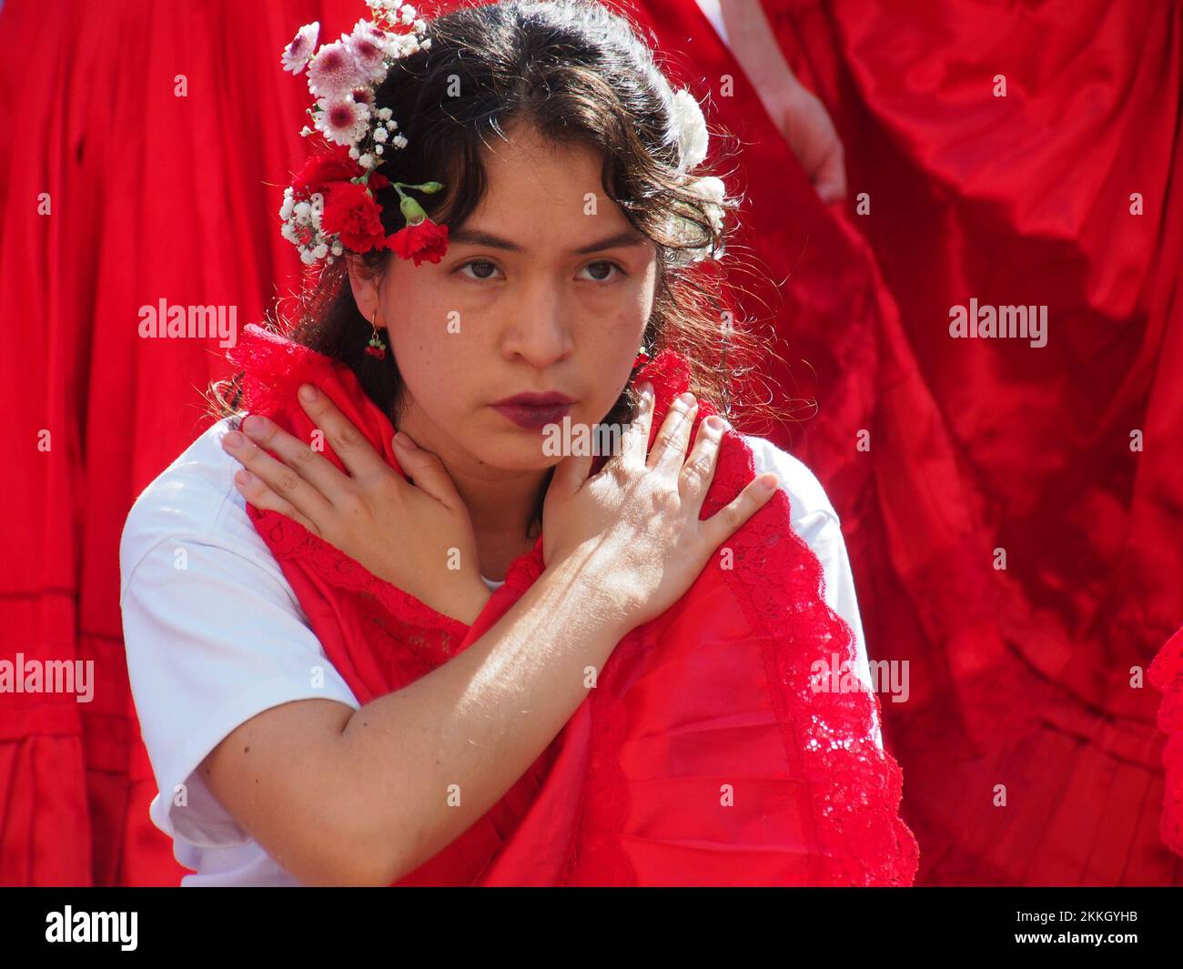 Women from 'Red Tide' activist group performing in red skirts in the street of Lima as part of the activities of the International Day for the Elimination of Violence against Women, an event that is commemorated annually on November 25, the date on which the three Mirabal sisters (Patria, Minerva and María Teresa) were murdered. in the Dominican Republic on 1960. Credit: Fotoholica Press Agency/Alamy Live News Stock Photo