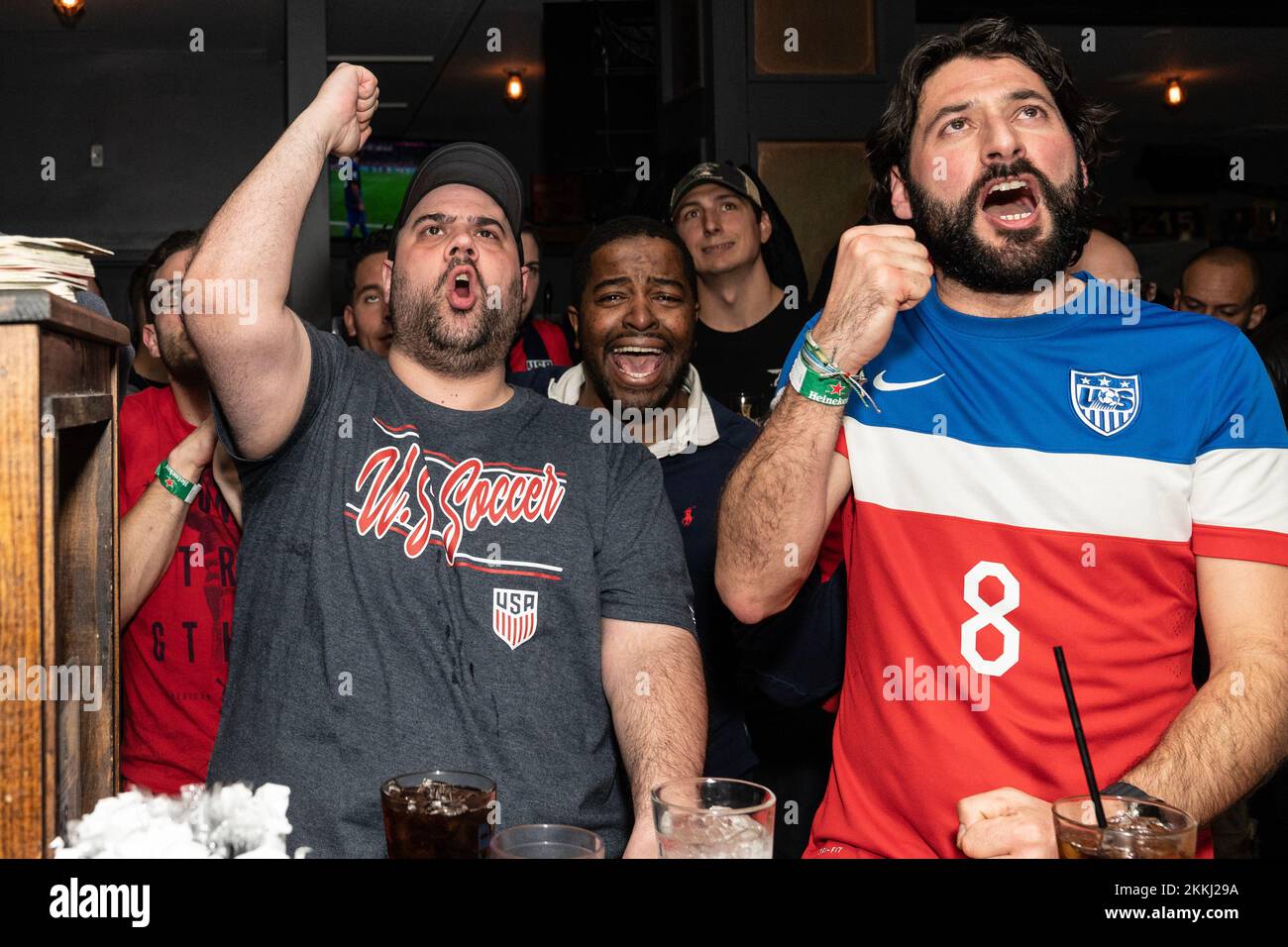 Fans of USA and England football teams cheer during their match at
