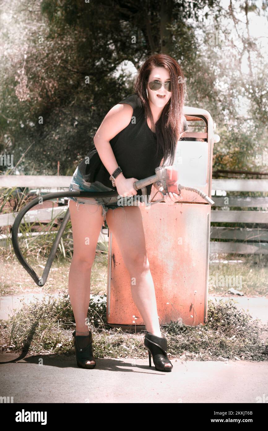 Retro Americana woman riding high on gasoline fumes does the petrol