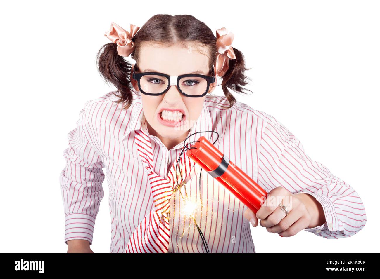 Isolated Nerd Business Woman Holding Lit Explosives While Gnashing Teeth With Fury In A Depiction Of A Explosion Time Bomb On White Background Stock Photo