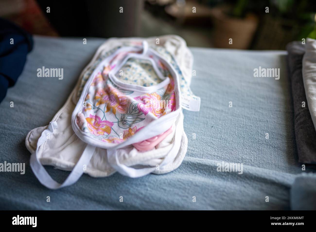 Folding and washing clean baby clothes in a home Stock Photo Alamy