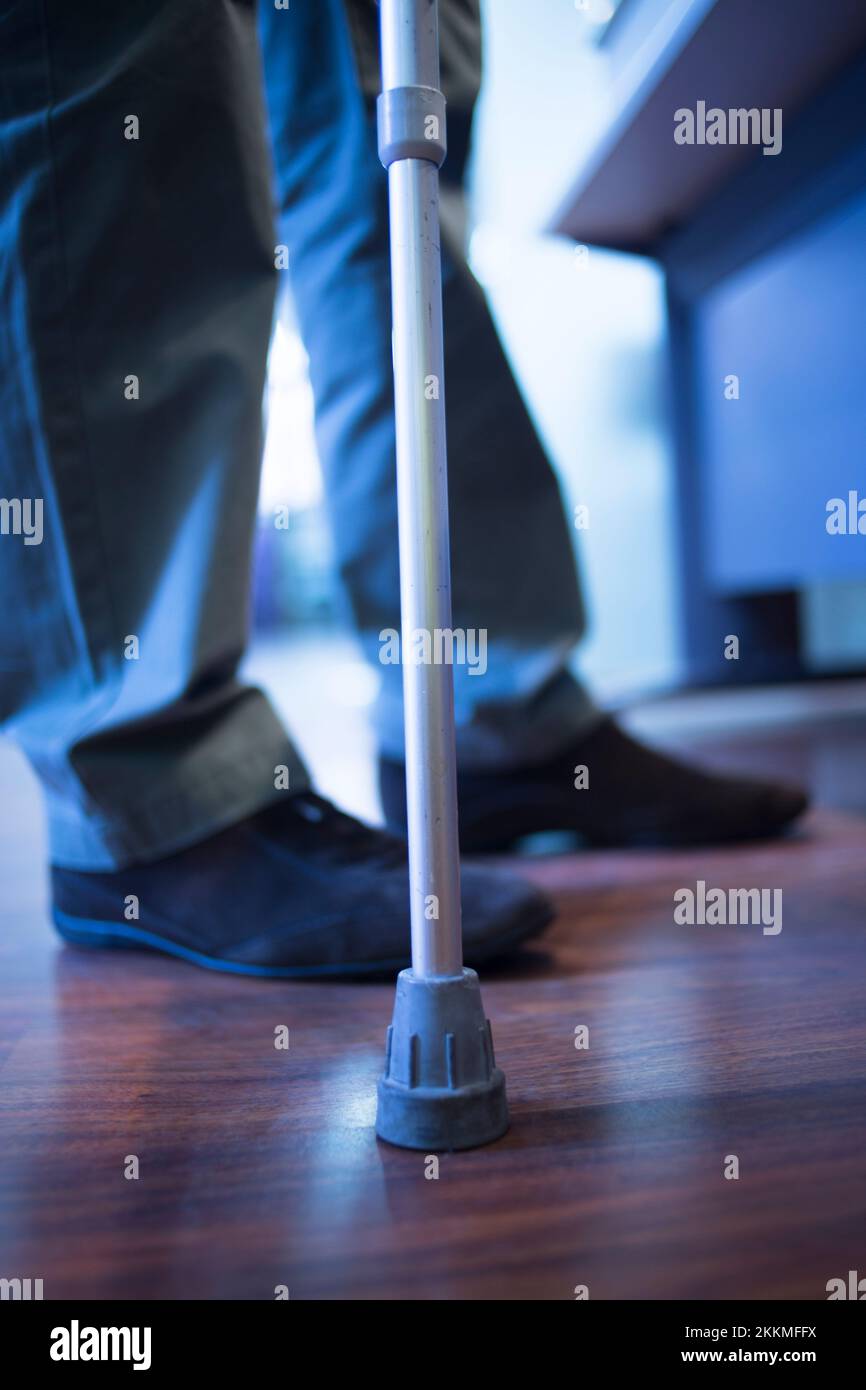 Man using walking stick Stock Photo Alamy