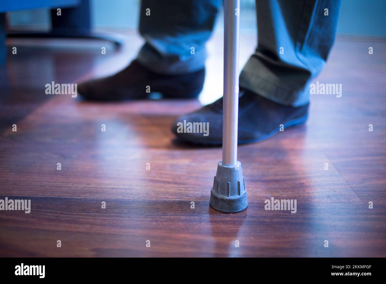 Man using walking stick Stock Photo