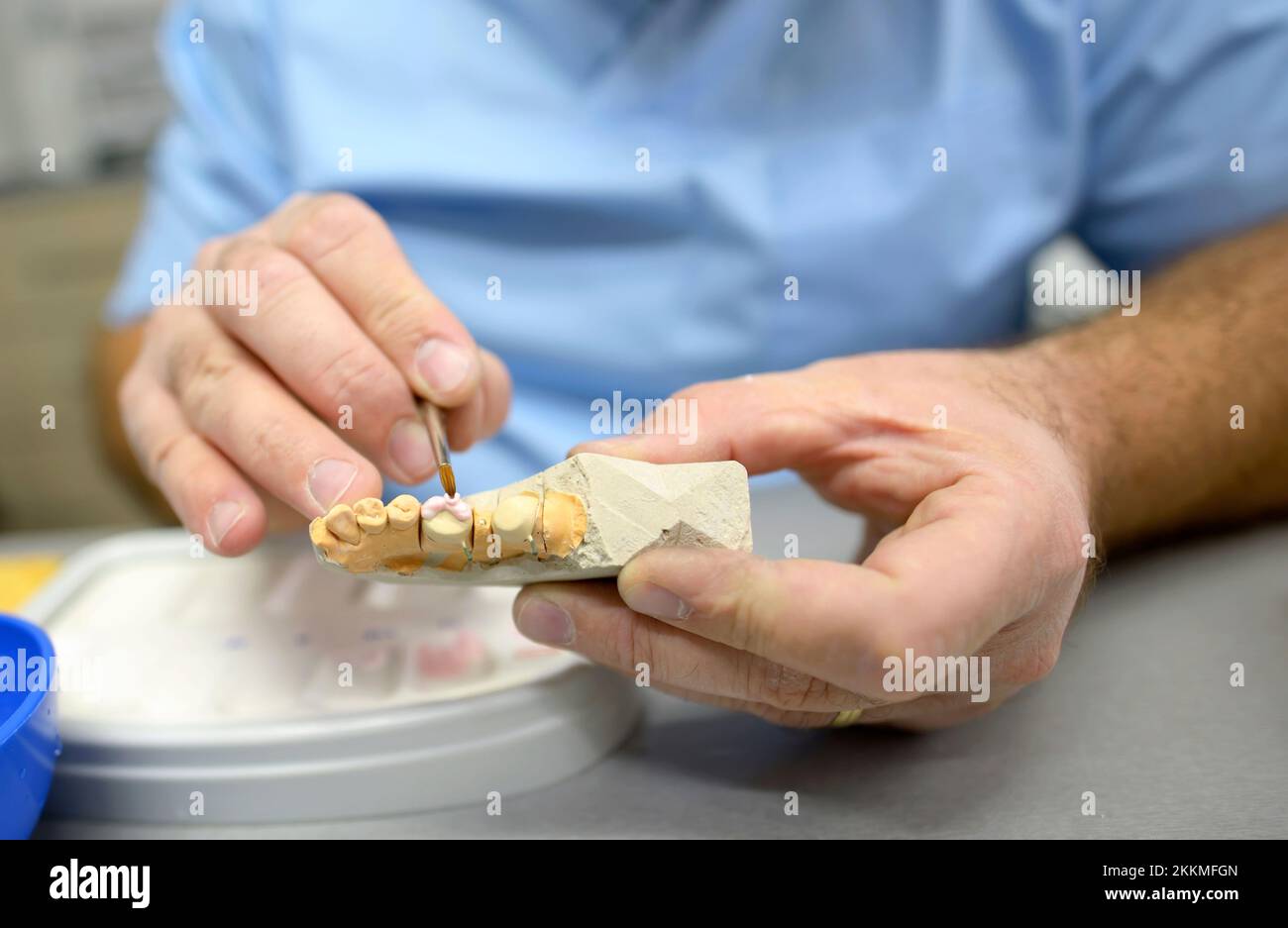 Dental technician in dental laboratory Stock Photo Alamy