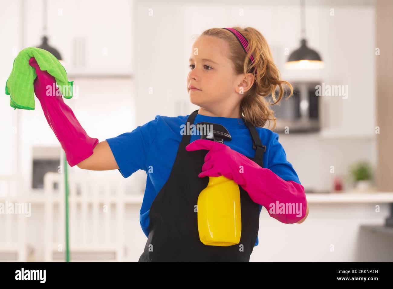 Cleaning house. Portrait of child cleaning, concept growth, development, family relationships. Housekeeping and home cleaning concept. Child use Stock Photo