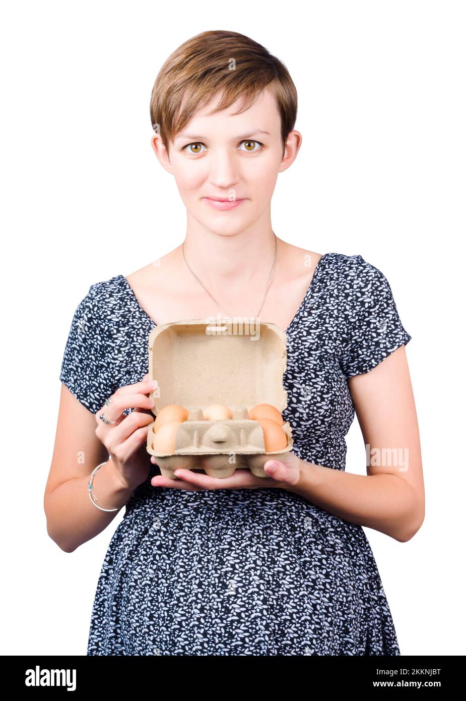 Young woman in the late stages of pregnancy displaying a cardboard