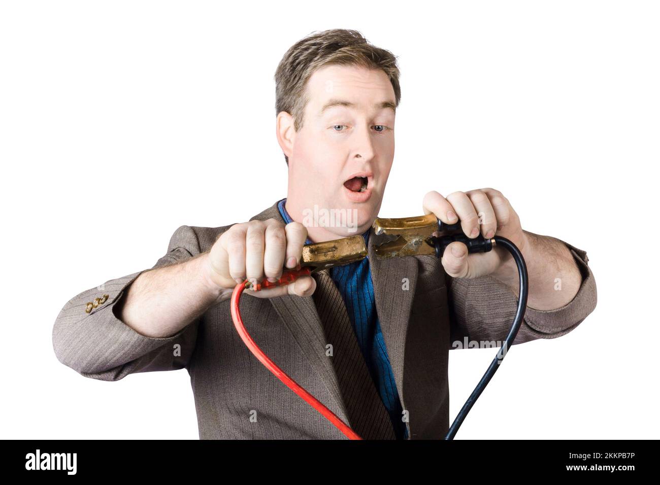 Mature Businessman Afraid To Connect Jumper Cables Together Stock Photo