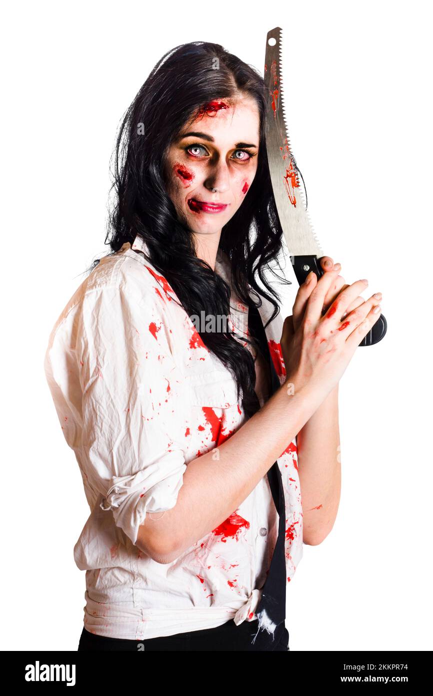 Zombie woman with wounds and blood stains holding a large knife with serrated edge isolated on white background Stock Photo