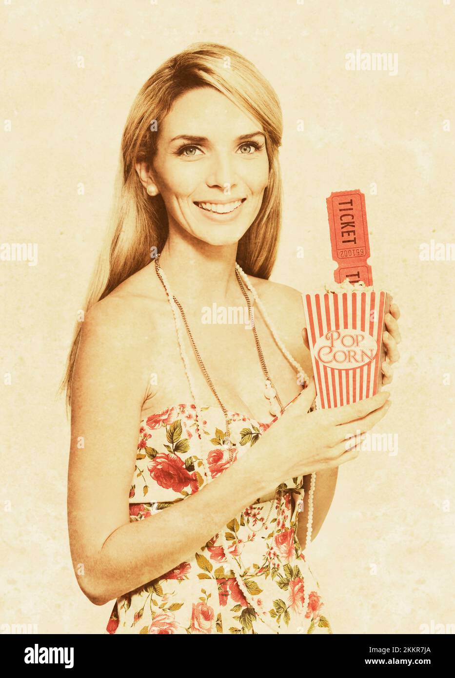 Faded And Textured Image Of A Vintage Woman With Smile, Pop Corn And Movie Tickets In A Olden Day Drive In And Movie Theatre Concept Stock Photo