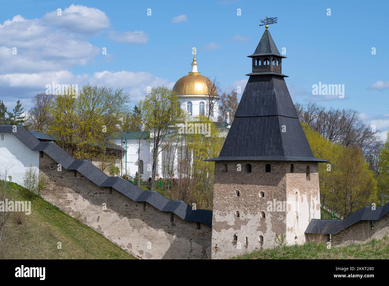 Ancient tower and St. Michael's Cathedral (Cathedral of Michael the Archangel) on a May sunny day. Holy Dormition Pskov-Caves Monastery. Pechory, Russ Stock Photo