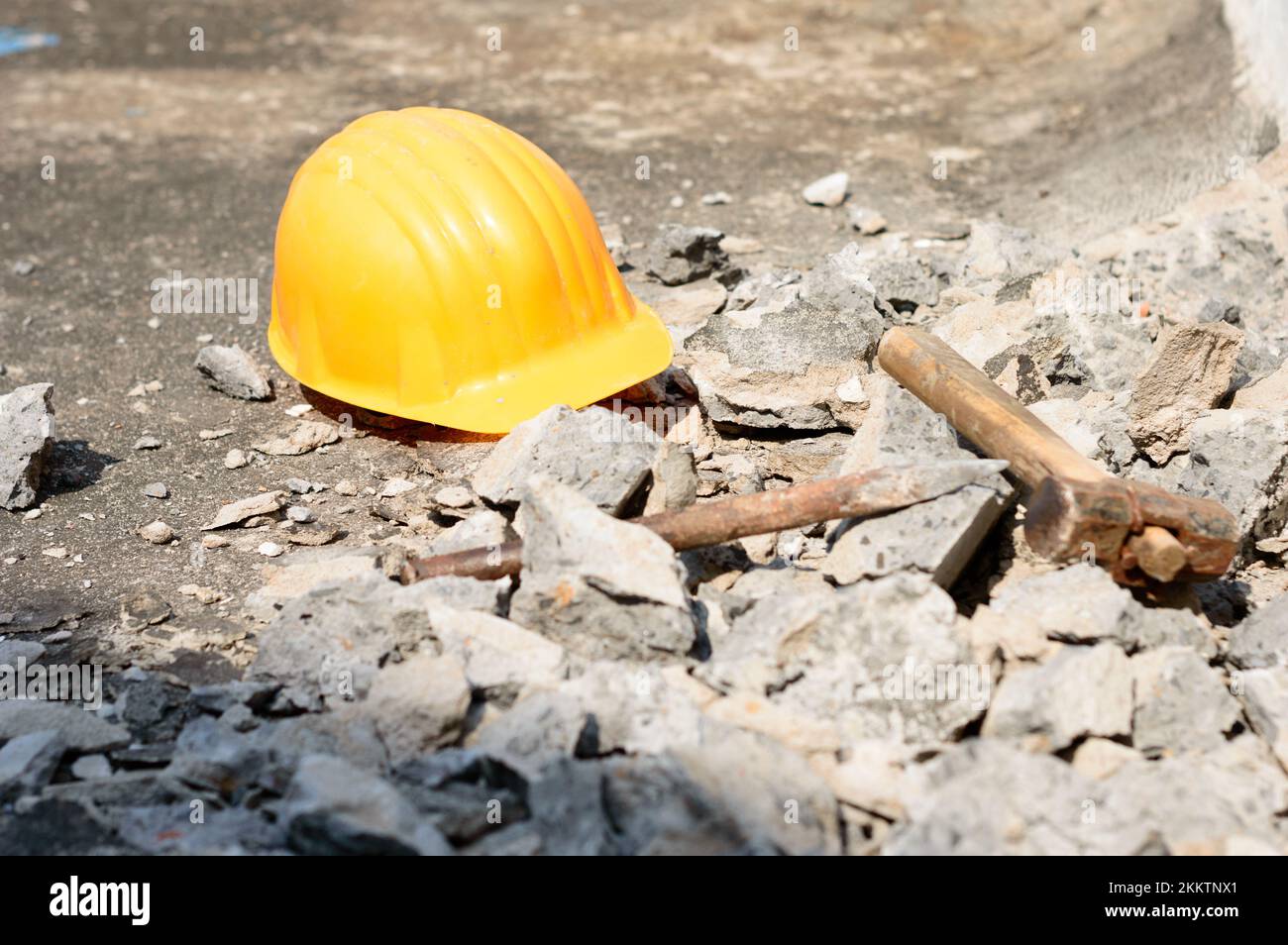 Safety Helmet in Construction Site. Yellow Hat. Safety Precautions Measures in Industrial workplace Background Concepts. Stock Photo
