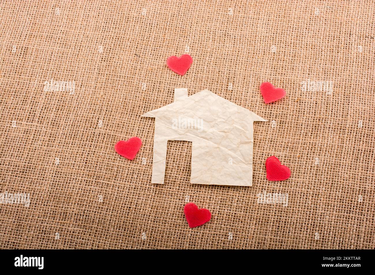 Heart shape around the paper house with a canvas background Stock Photo ...