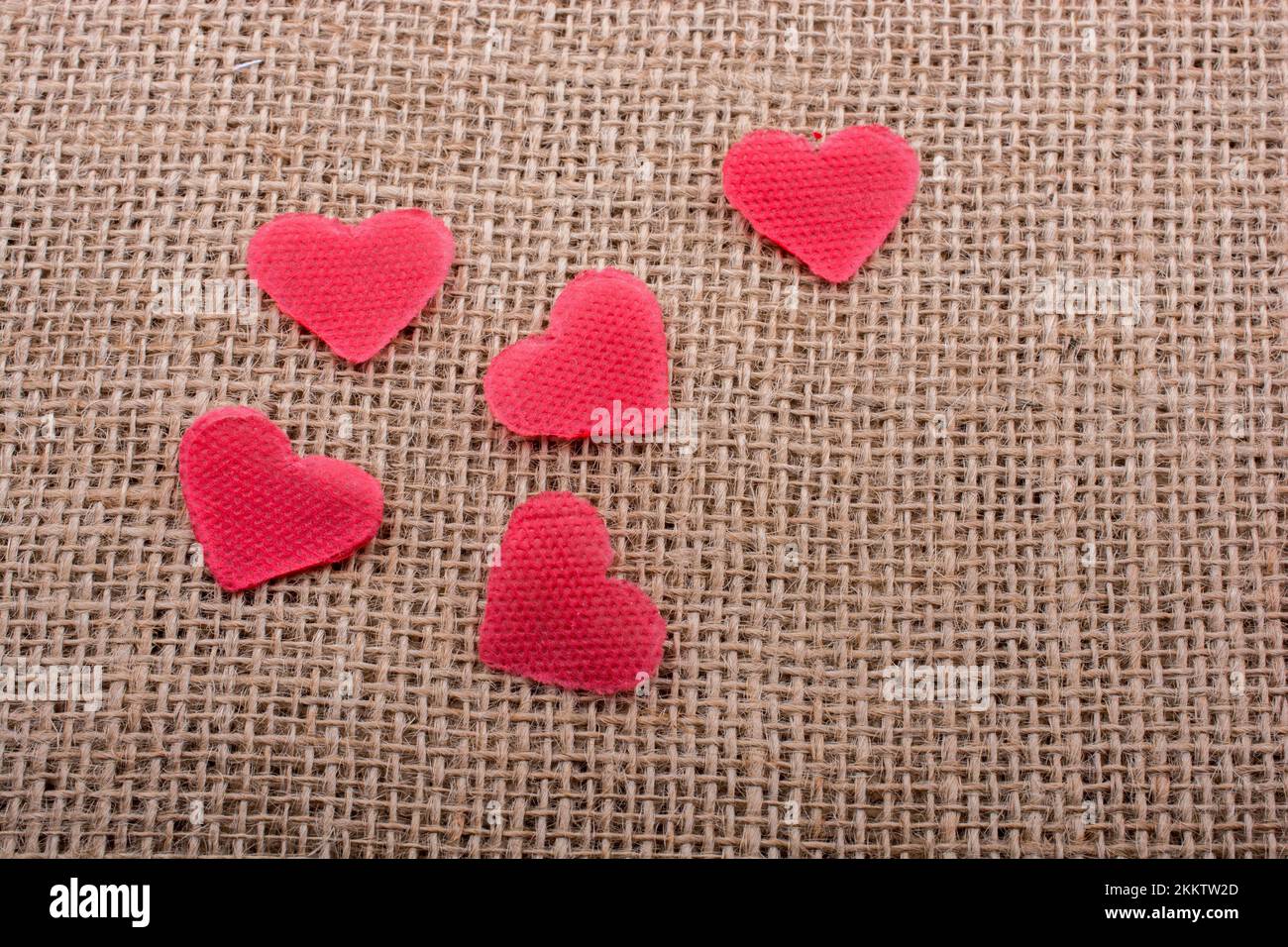 Heart shaped objects on a linen canvas Stock Photo Alamy