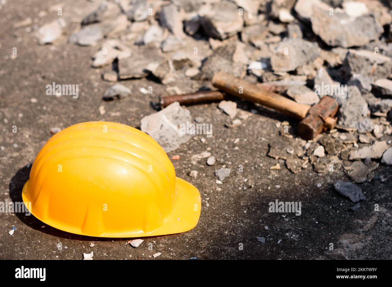 Safety Helmet in Construction Site. Yellow Hat. Safety Precautions Measures in Industrial workplace Background Concepts. Stock Photo
