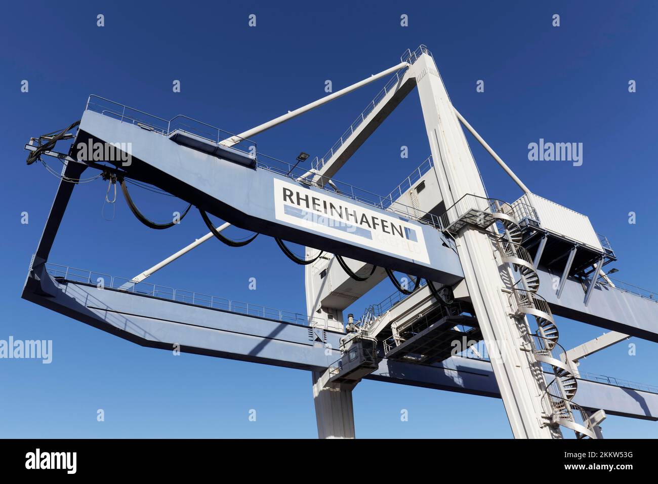 Container crane against a blue sky, Rhine port Krefeld, North Rhine-Westphalia, Germany, Europe Stock Photo