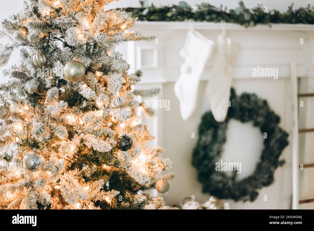 Blurred Christmas background with Christmas tree and fireplace Stock Photo