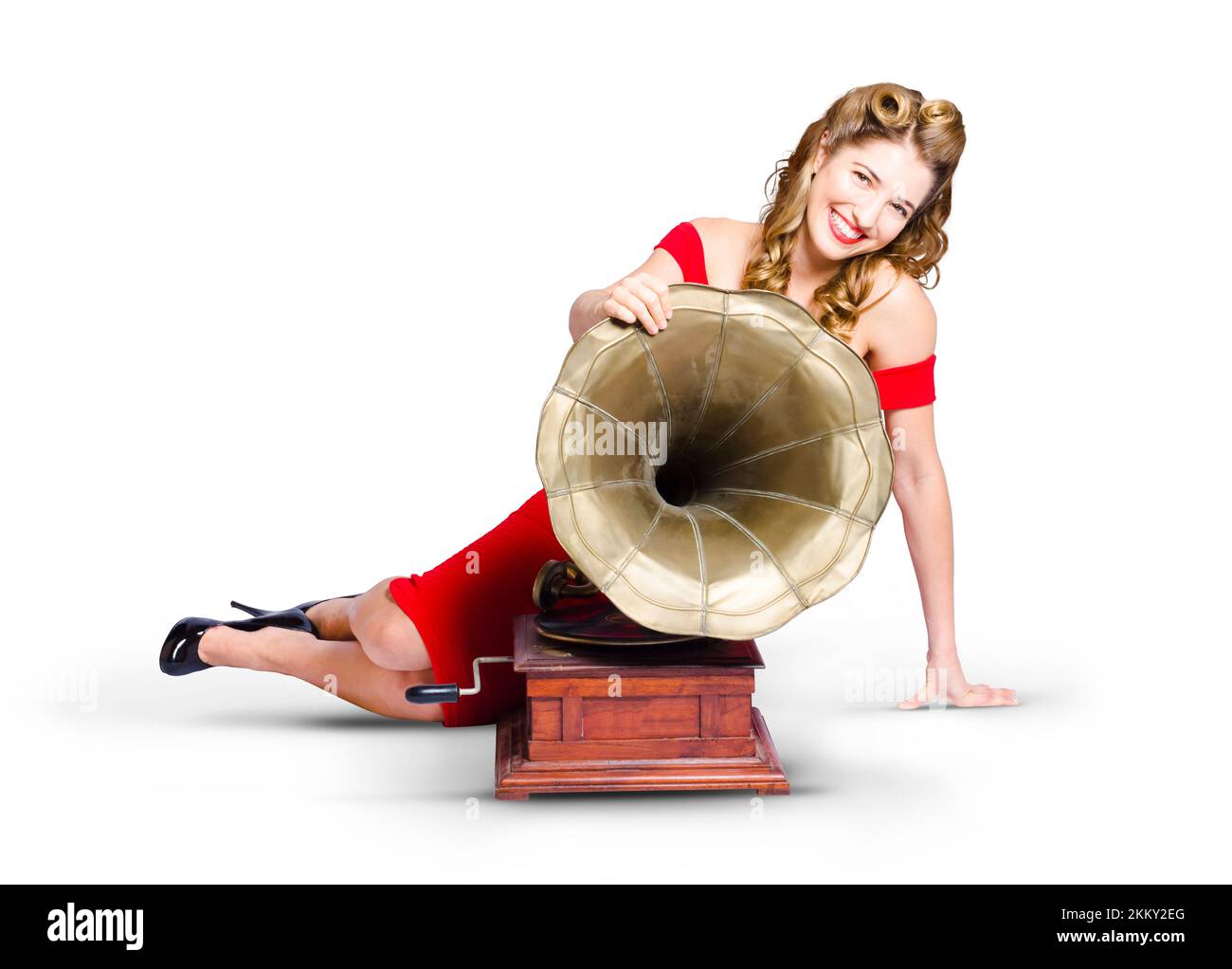 Vintage style portrait of a beautiful retro pinup girl in red dress
