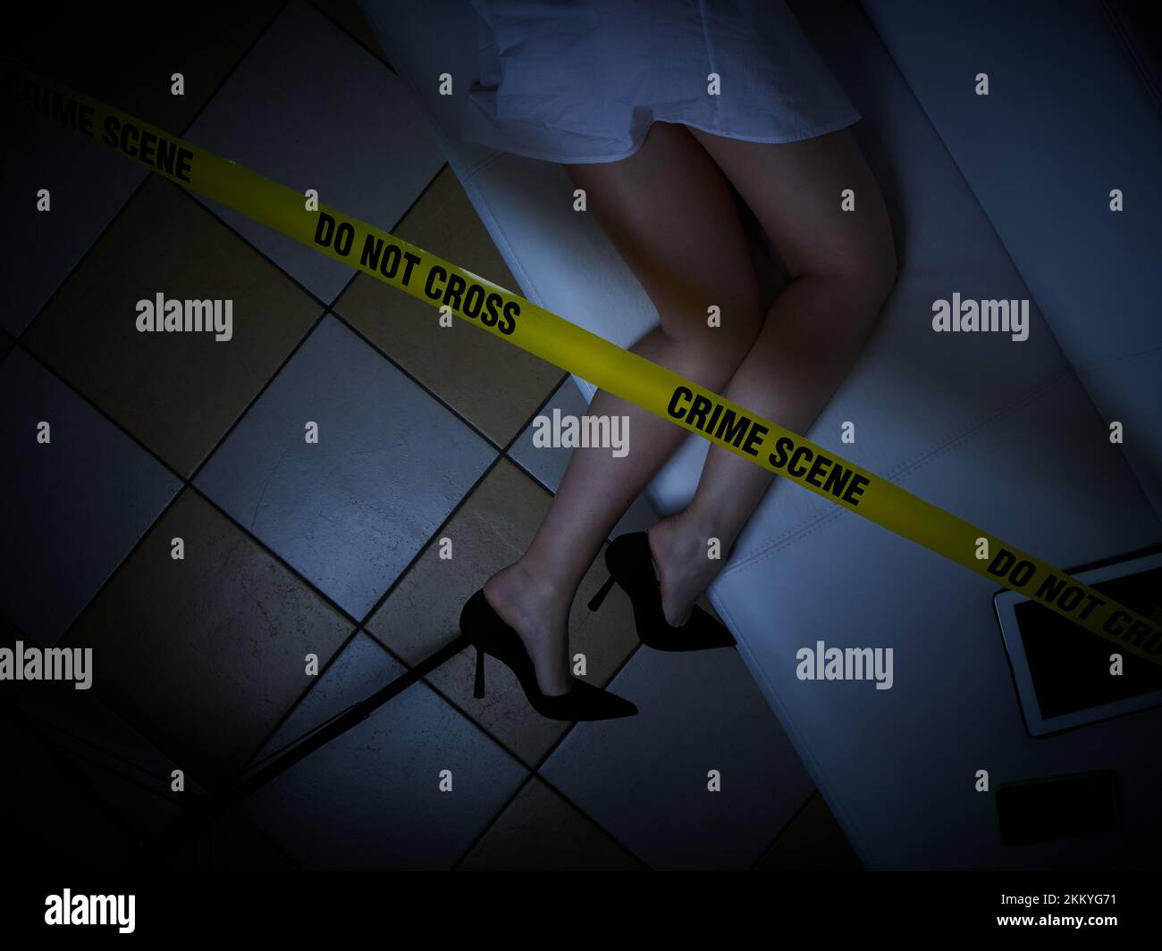 young woman lying dead on the floor after rape - crime scene Stock Photo