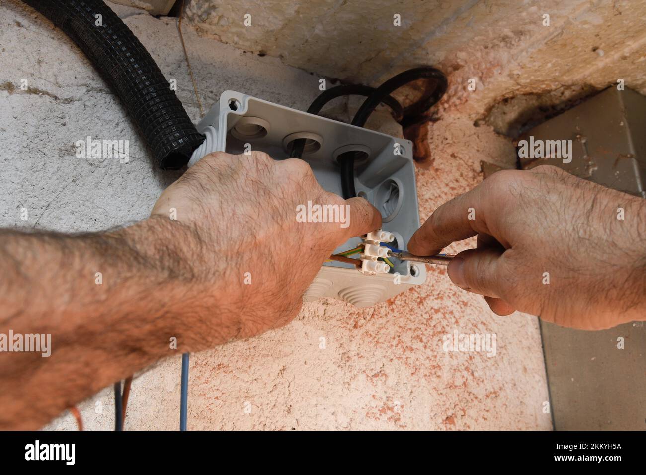 Electrician installing a wiring Stock Photo