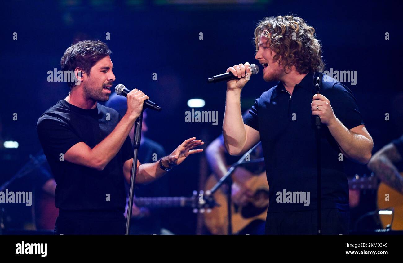 Leipzig, Germany. 12th Oct, 2022. German singer-songwriter Max Giesinger (l) performs in the ARD entertainment show 'Your Songs' together with singer-songwriter Michael Schulte. Credit: Hendrik Schmidt/dpa/Alamy Live News Stock Photo