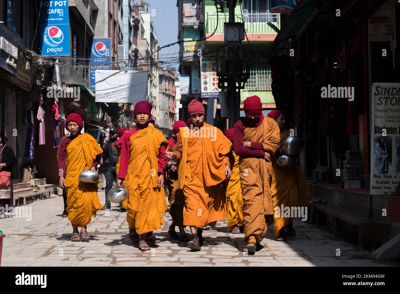 Kathmandu, Nepal April 20,2019 Buddhist monks walk the streets of