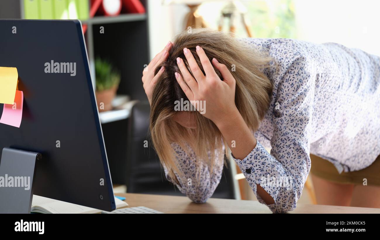 Woman head in hands sad computer hi-res stock photography and images ...