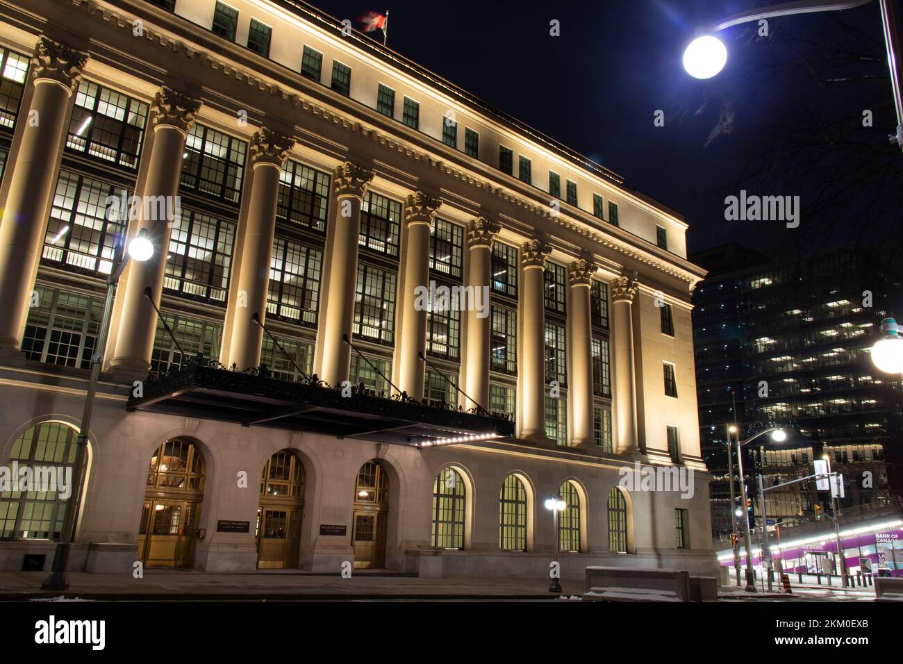 The Wellington Building, built in 1927, now occupied by the House of Commons and serving many federal government functions is seen lit at night. Stock Photo