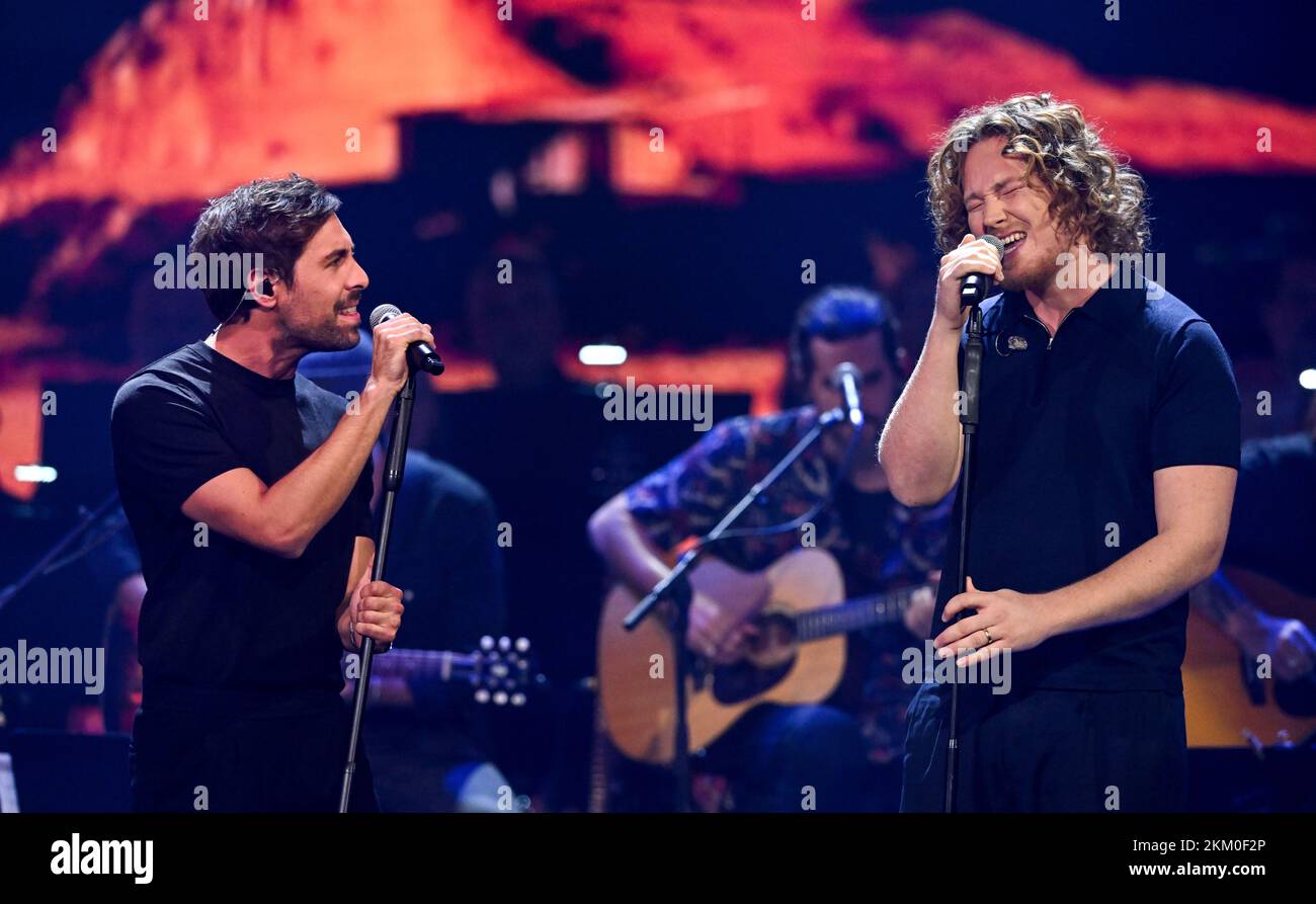 Leipzig, Germany. 12th Oct, 2022. German singer-songwriter Max Giesinger (l) performs in the ARD entertainment show 'Your Songs' together with singer-songwriter Michael Schulte. Credit: Hendrik Schmidt/dpa/Alamy Live News Stock Photo