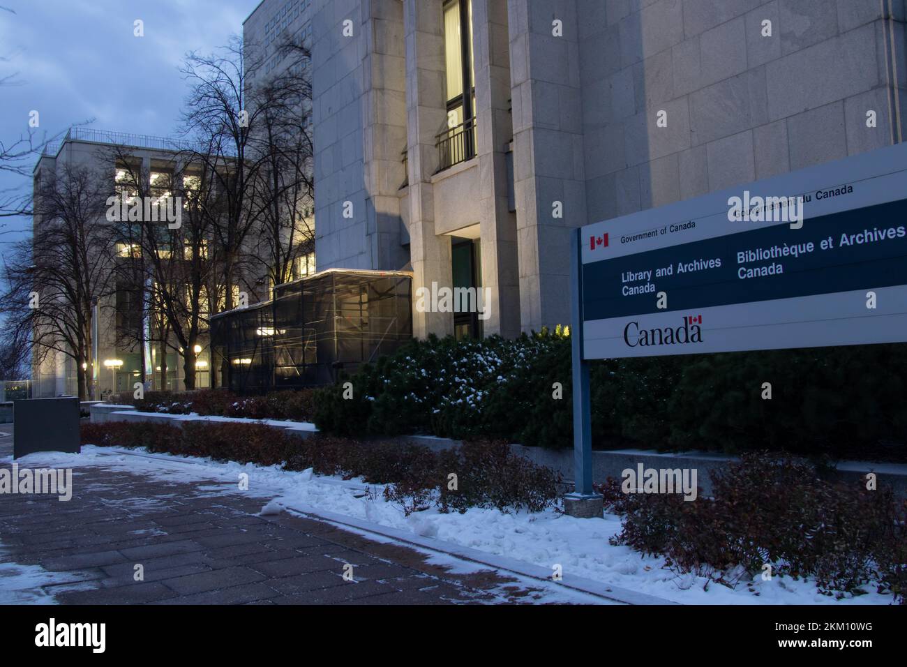 A sign for the Government of Canada office building, Library and Archives Canada, is seen in the early morning in downtown Ottawa. Stock Photo