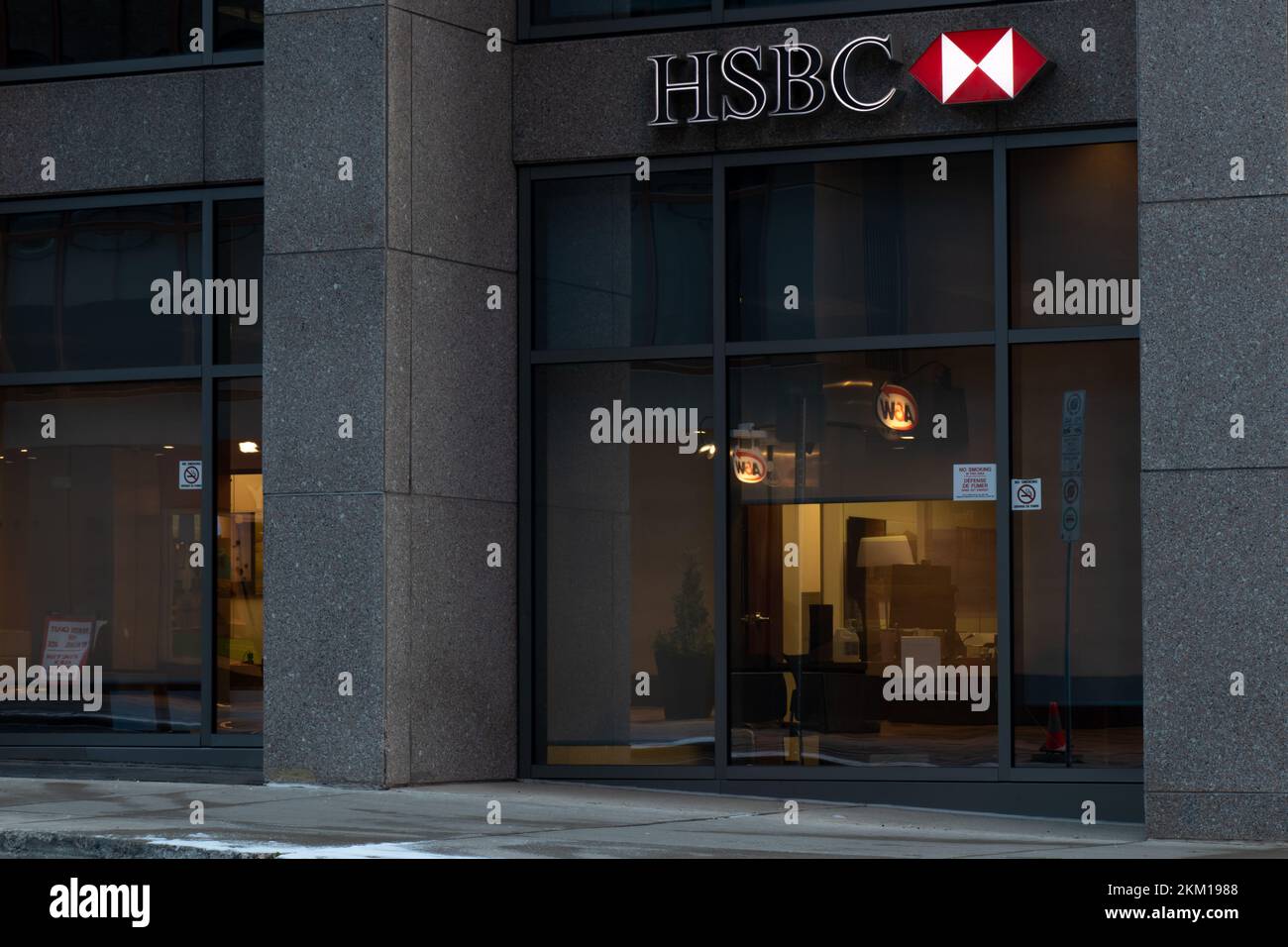 The HSBC logo is seen above a bank branch in Canada's capital, Ottawa. HSBC is a global, British bank bank and financial services holding company. Stock Photo