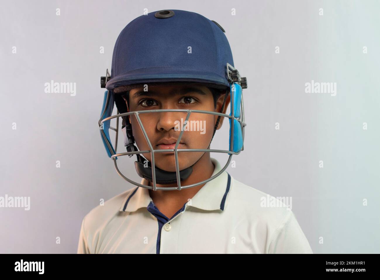Portrait of boy wearing cricket Helmet Stock Photo