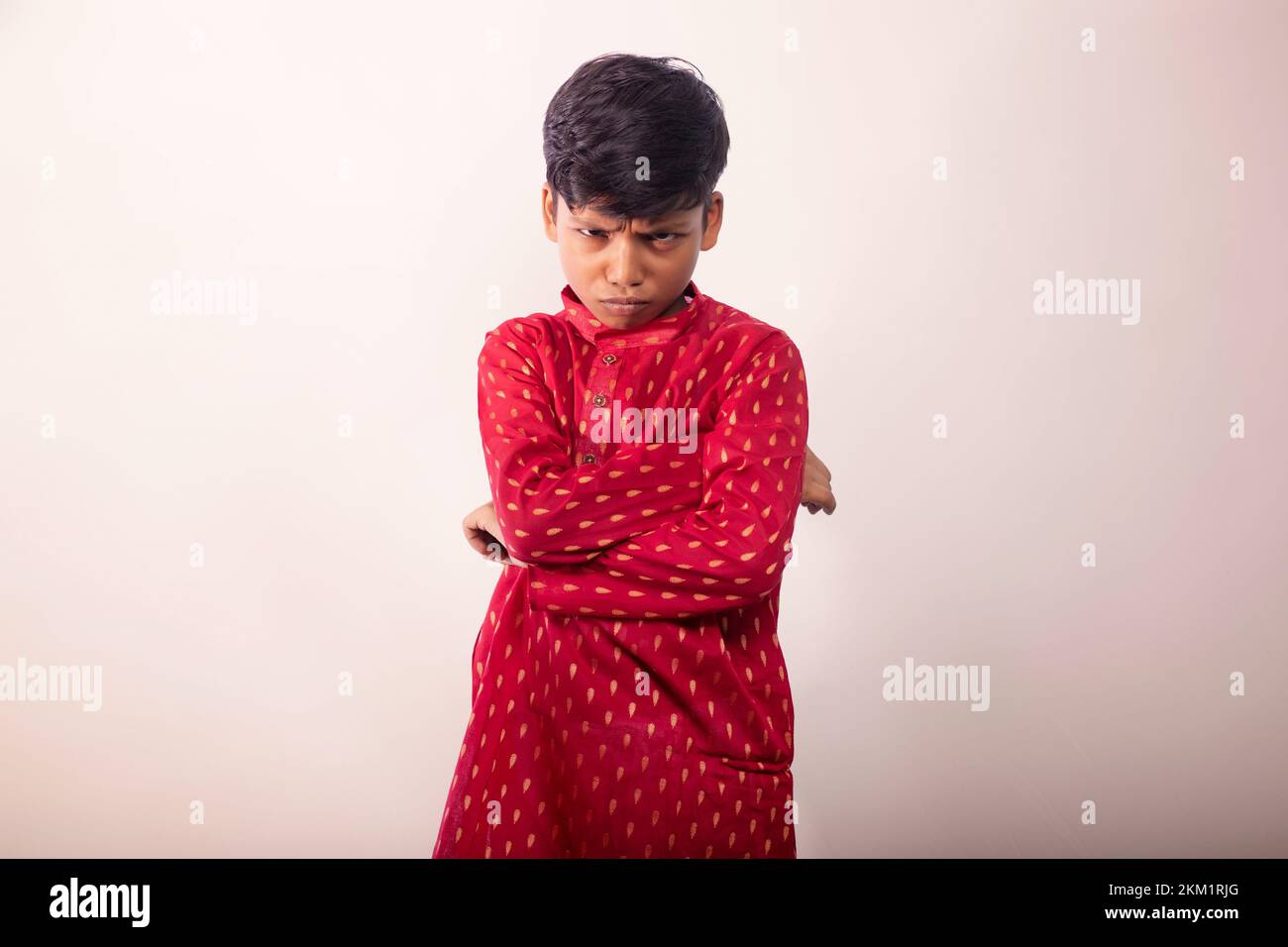 Boy wearing a traditional dress and Angry face Stock Photo