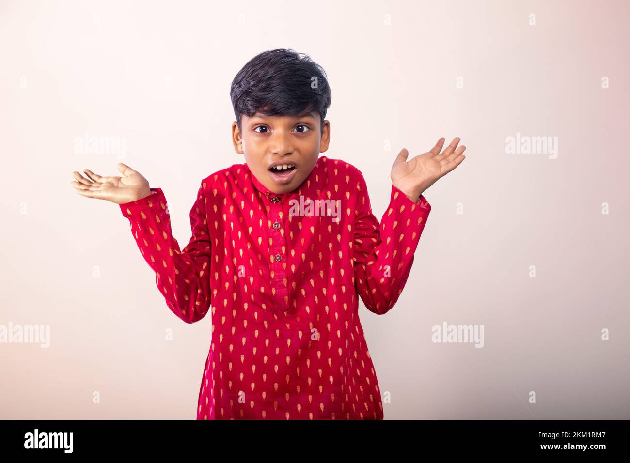 Boy wearing a traditional dress and funny face Stock Photo