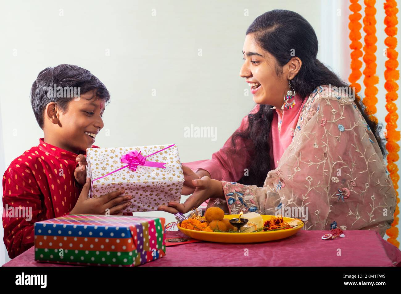 Brother giving gift to his sister on the occasion of Raksha Bandhan