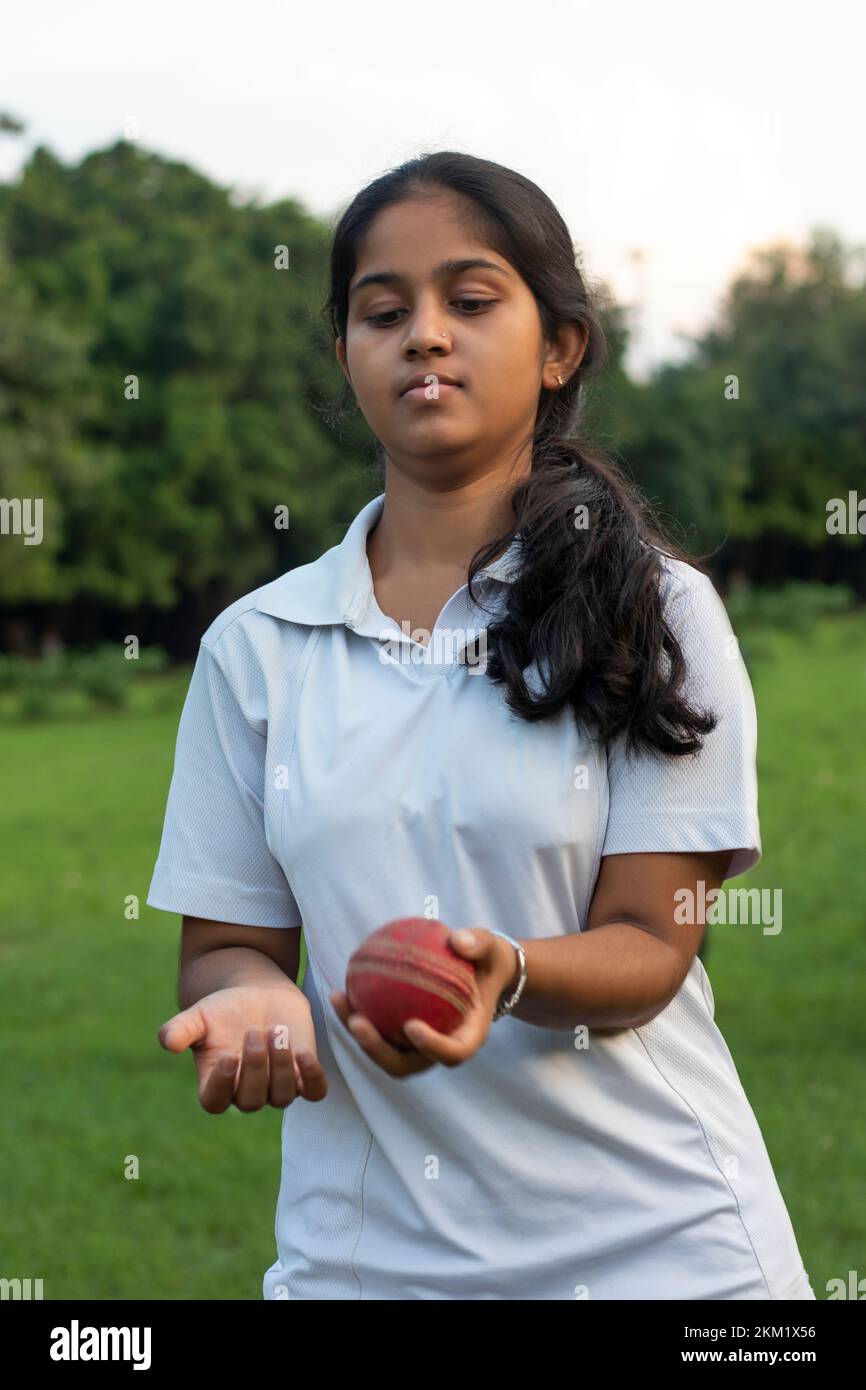 Female cricket players practice in the ground with ball Stock Photo Alamy